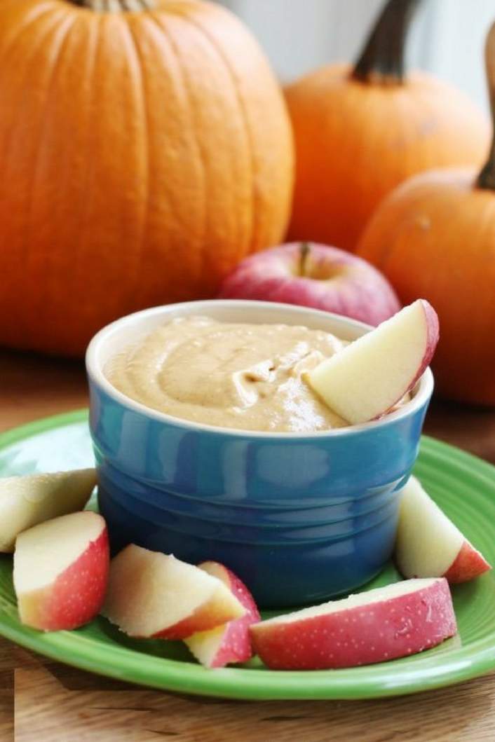 Easy Pumpkin Cream Cheese Dip with apples and a pumpkin.