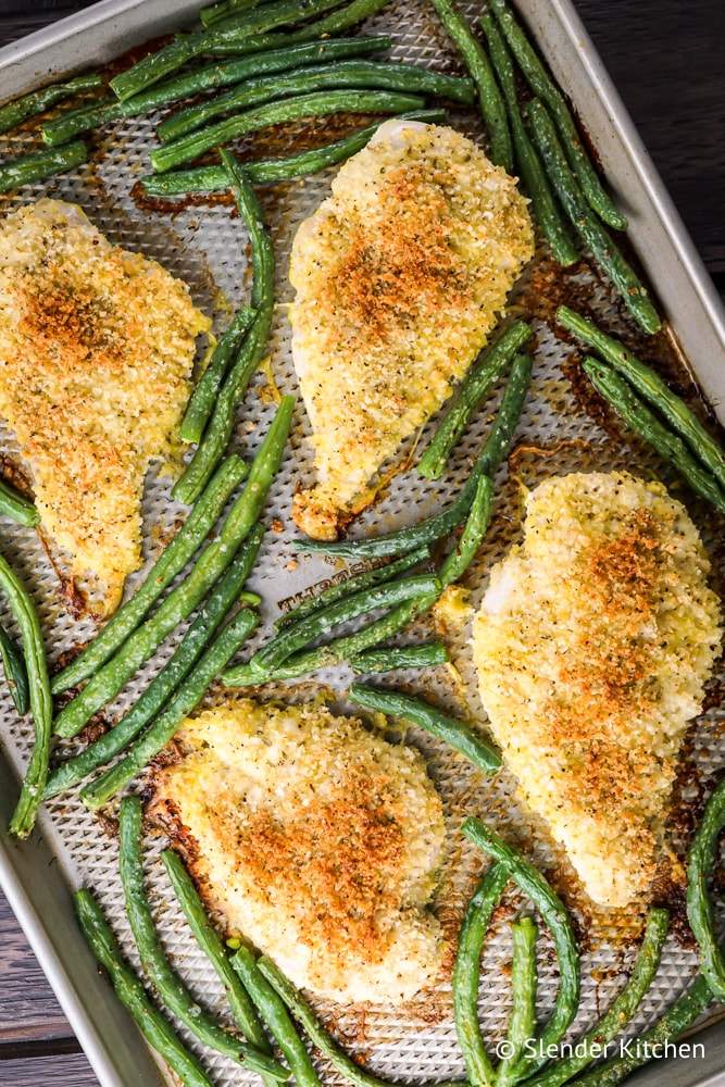 Weight watchers Lemon Pepper Chicken on a gray sheet pan with green beans.