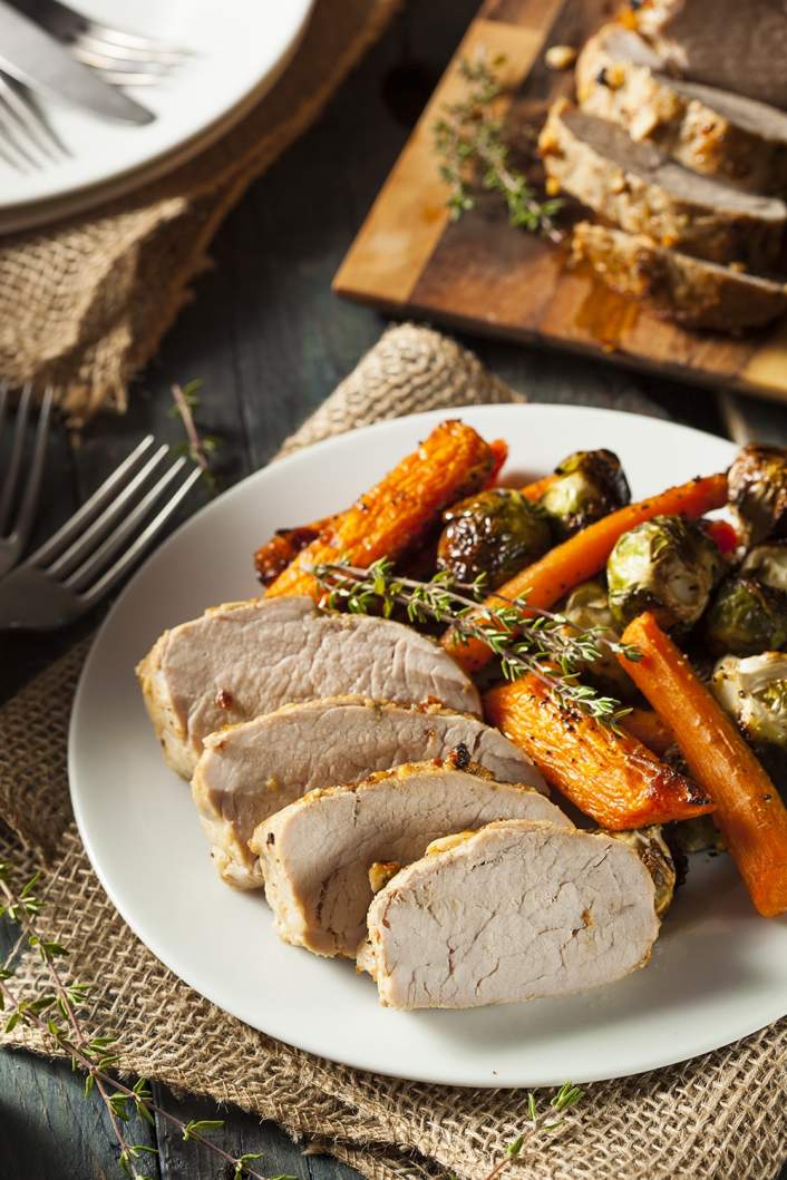 Slow Cooker Maple Pork Tenderloin with carrots and brussels sprouts.
