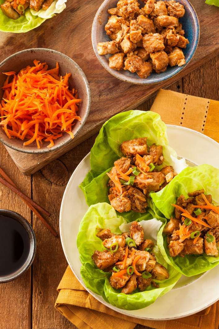 Weight Watchers Slow Cooker Korean Chicken served in lettuce wraps with carrots.