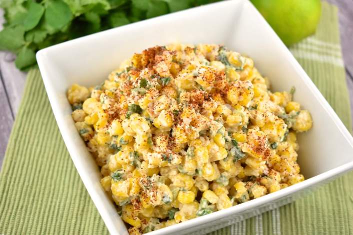 Weight Watchers Mexican Street Corn Salad on a wooden background.