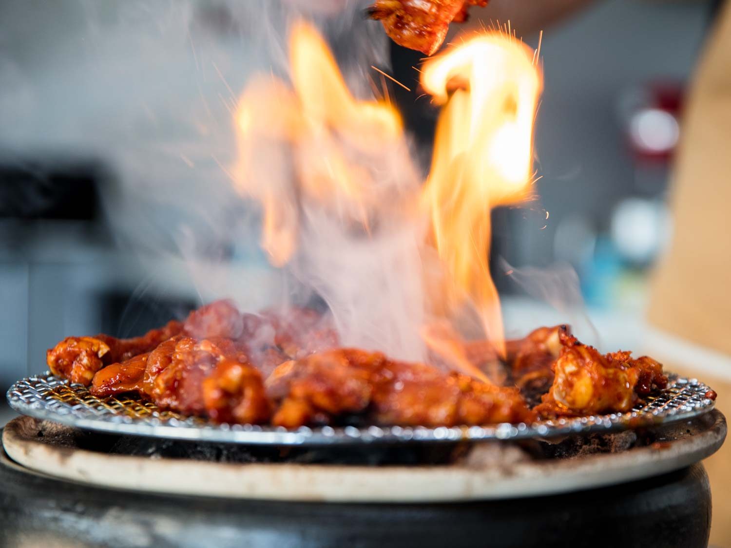 Flames licking up on the grill