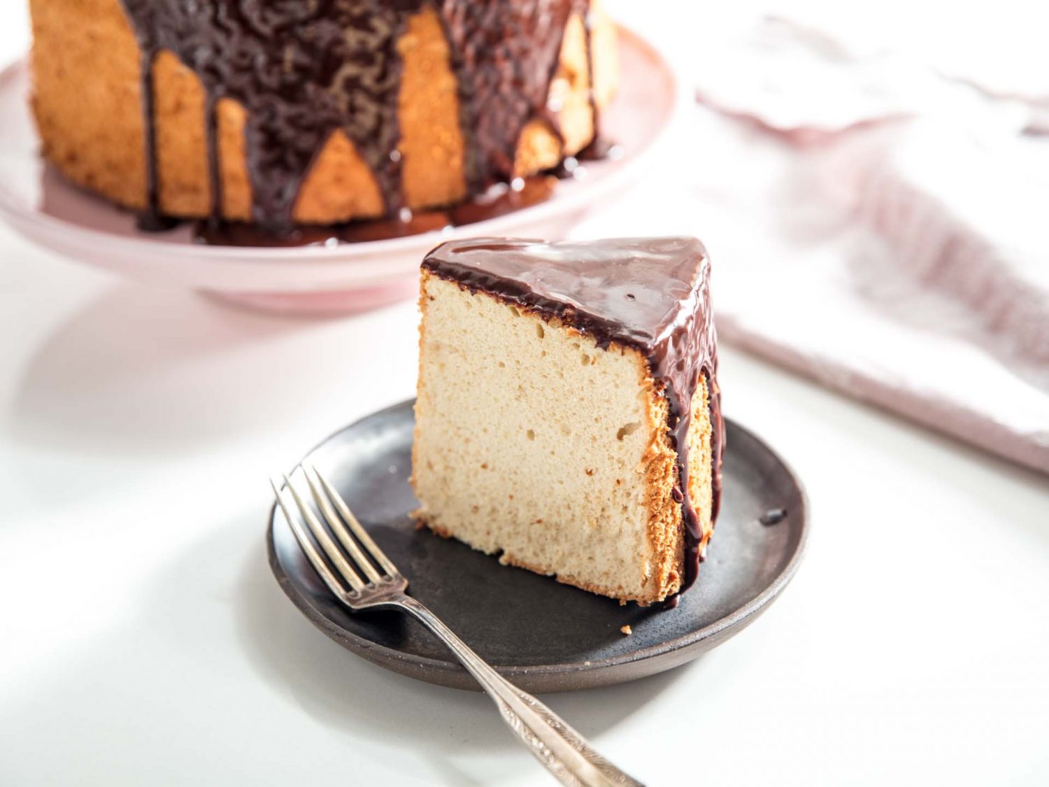 a slice of chocolate-glazed angel food cake