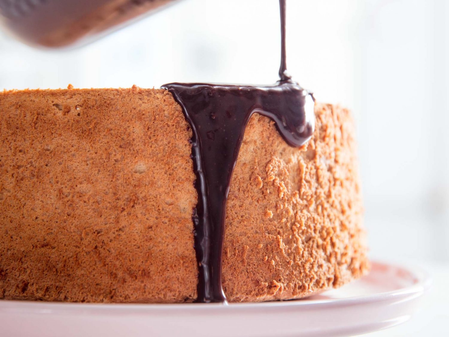 maple angel food cake with a drizzle of chocolate ganache