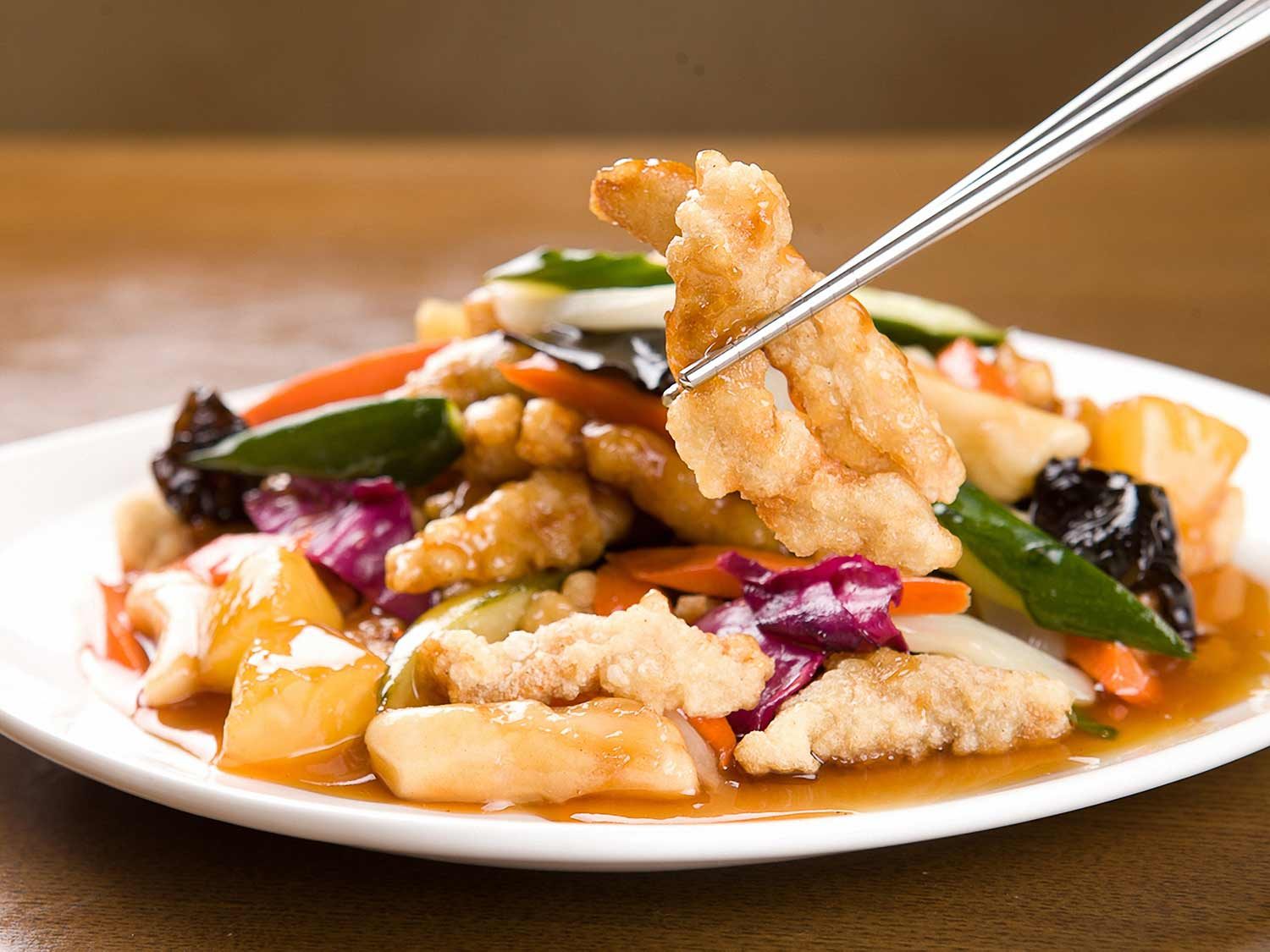 A plate of tangsuyuk (Chinese-Korean sweet-and-sour pork) with vegetables