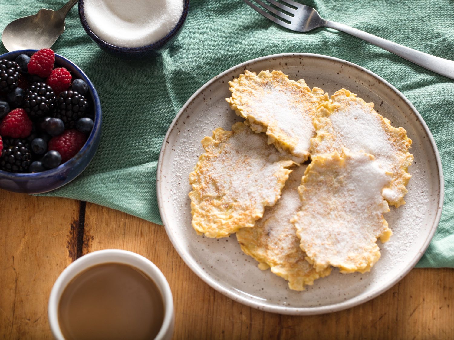 A plate of matzo brei pancakes with sugar