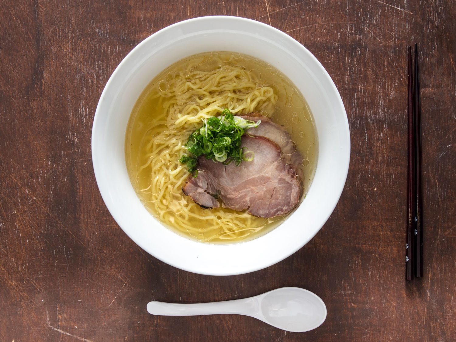 Overhead view of bowl of shio ramen with rolled shoulder chashu