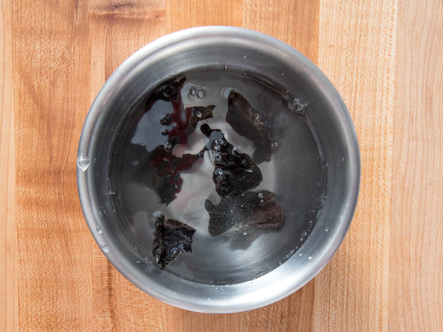 Soaking the dried woodear mushrooms