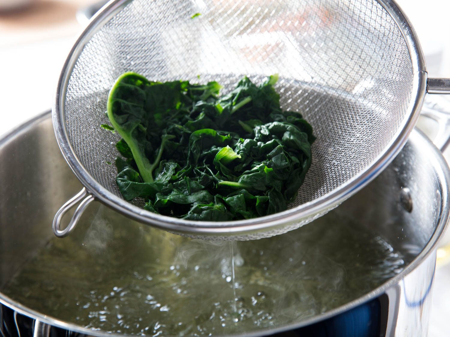 Blanching the spinach for japchae