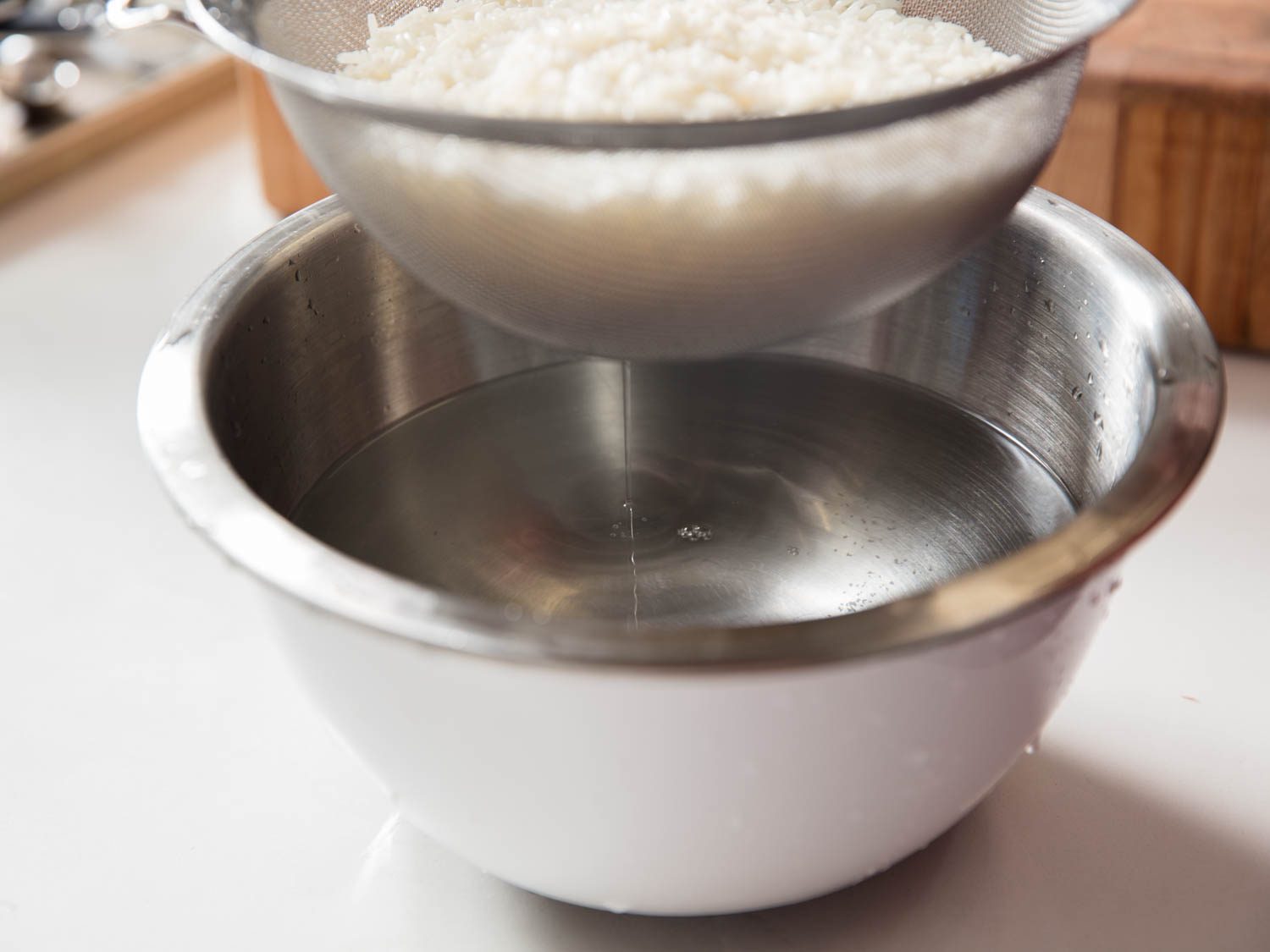 Water running clear after rinsing sticky rice.