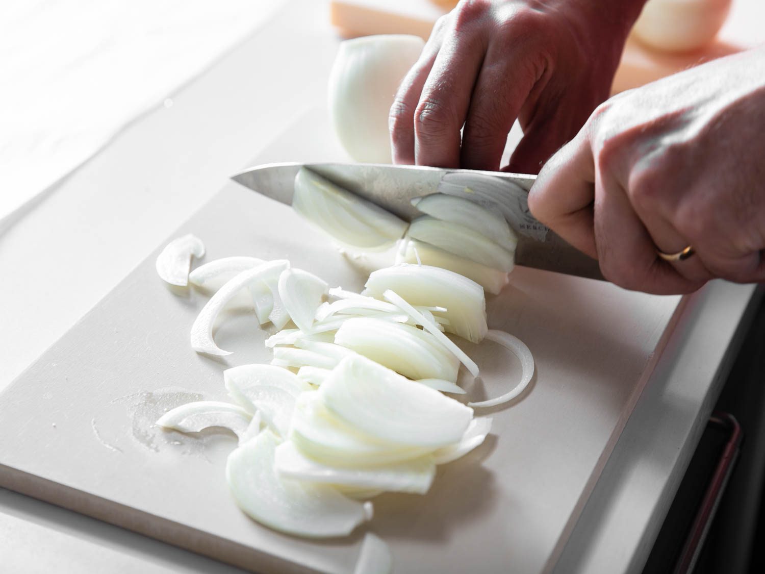 Slicing onions: one good way to test a cutting board's performance.