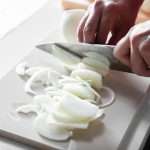 Slicing onions: one good way to test a cutting board
