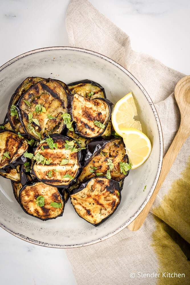 How to grill eggplant with sliced eggplant on a plate with a napkin.