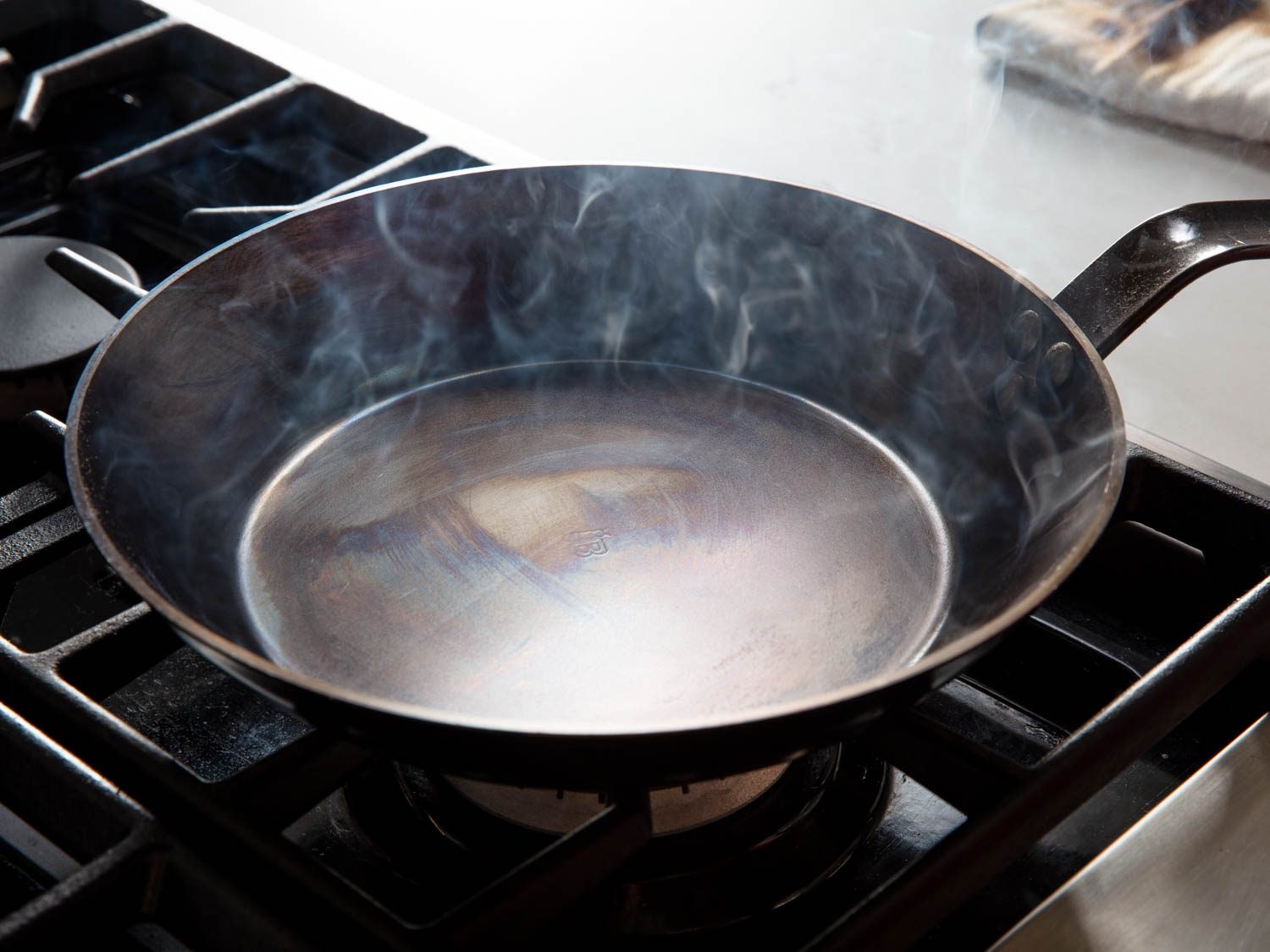A carbon steel pan in the early stages of seasoning
