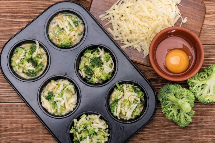 Broccoli Cheddar Egg Muffins before going into the oven to be baked.