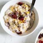 Bowl of overnight oats with cranberries and orange