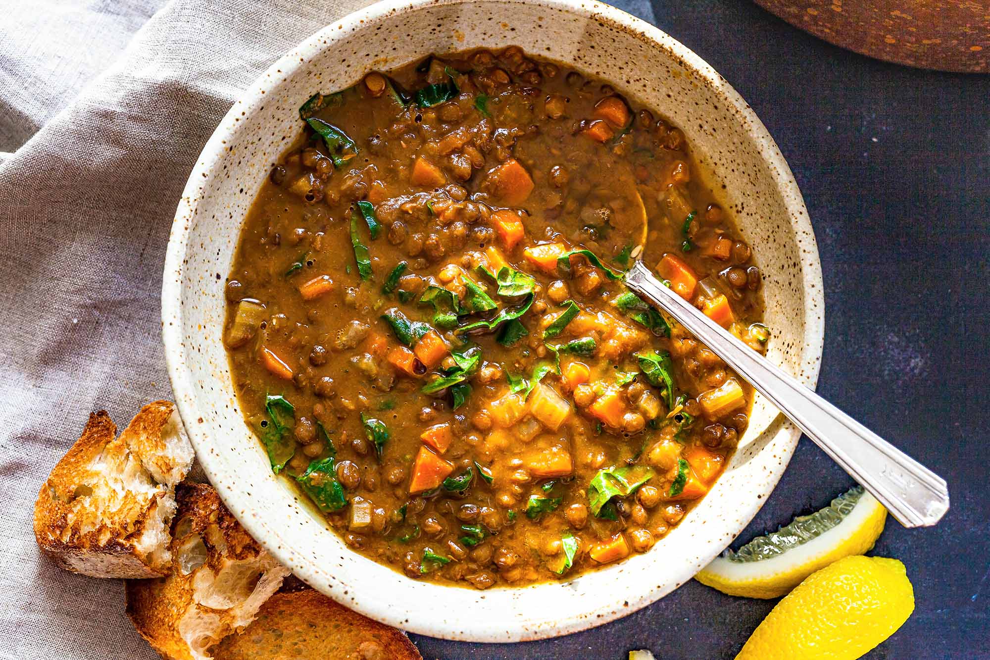 Easy Lentil Soup in a bowl with a spoon.