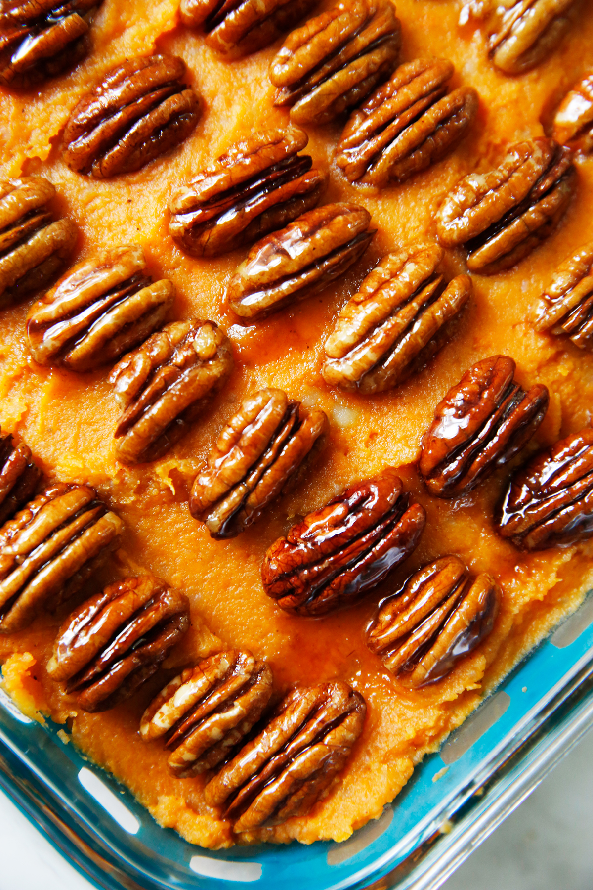 Healthy sweet potato casserole with candied pecans on top