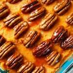 Healthy sweet potato casserole with candied pecans on top