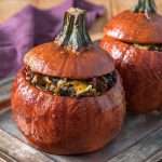 Stuffed pumpkins with Gruyere, mushrooms, kale (for Thanksgiving and holidays), glazed and tops on.