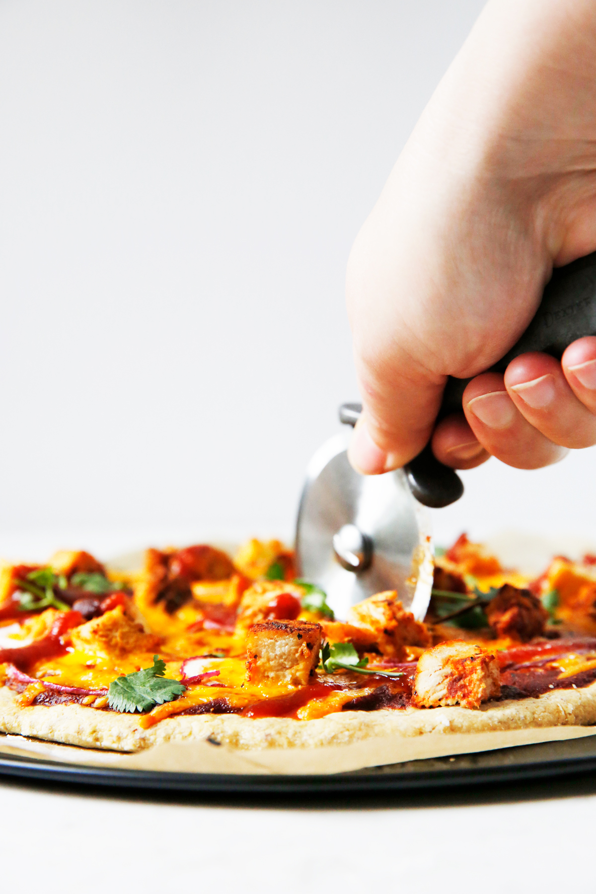 Cutting into easy barbecue chicken pizza