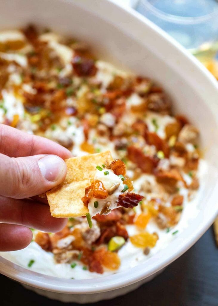 Serve 7-layer goat cheese dip with pita chips