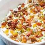 Top 7-layer goat cheese dip with figs and raisins