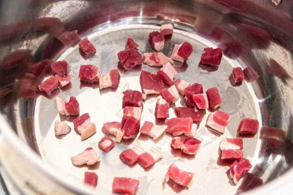 Salt pork in a pot ready to cook