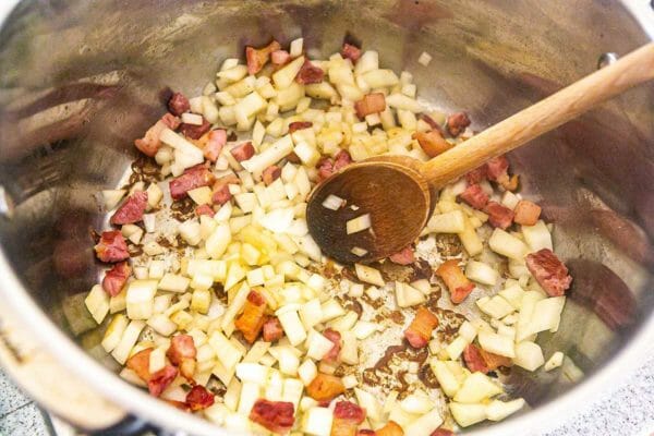 Salt pork and onions cooking in a pan