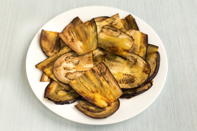 A plateful of sliced and grilled aubergine (eggplant).