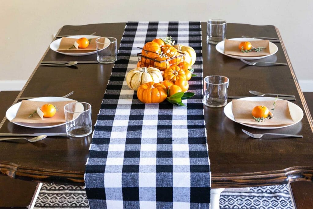 orange black and white thanksgiving table setup