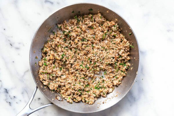 Cooked filling for stuffed mushrooms: mushroom stems, walnuts, shallots, and garlic