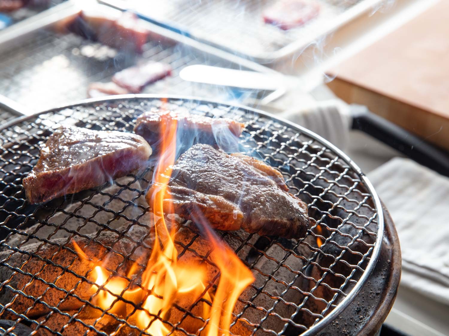 Wagyu steak cooking on a hibachi grill