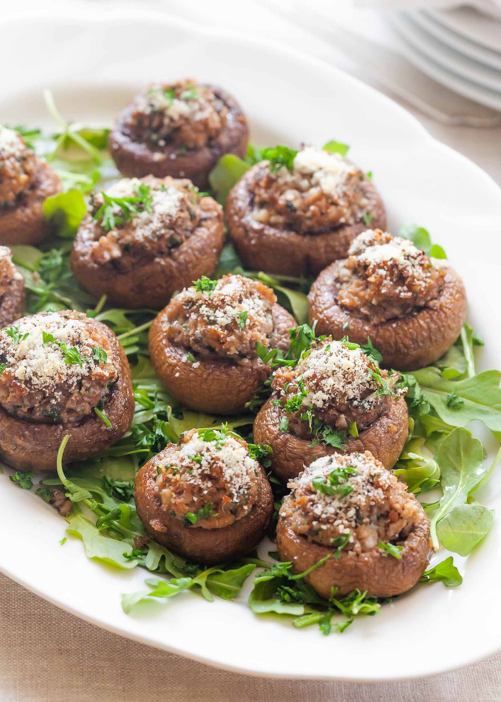 baked stuffed mushroom caps on a serving platter